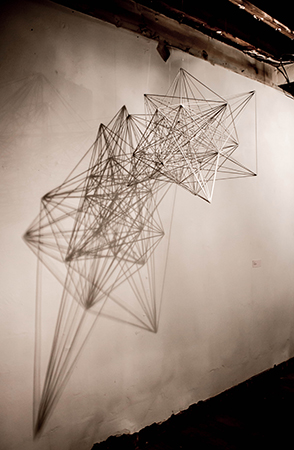 Mona Choo, Between Dimensions, 2012, Wooden rods, glue, light source, approx 65 x 65 x 80cm